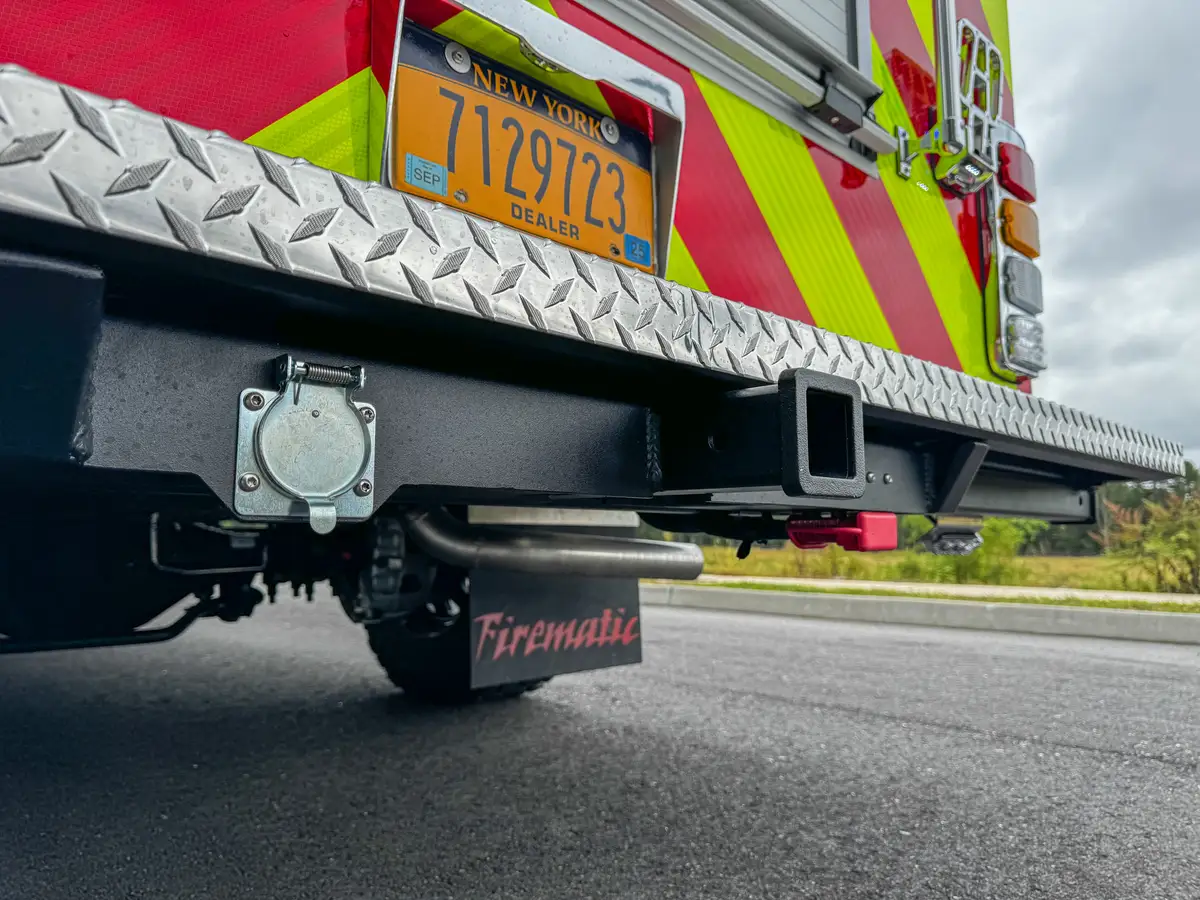 Low rear underside angle showing bumper structure and suspension area.